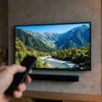 Smart TV being controlled with a remote on a media wall