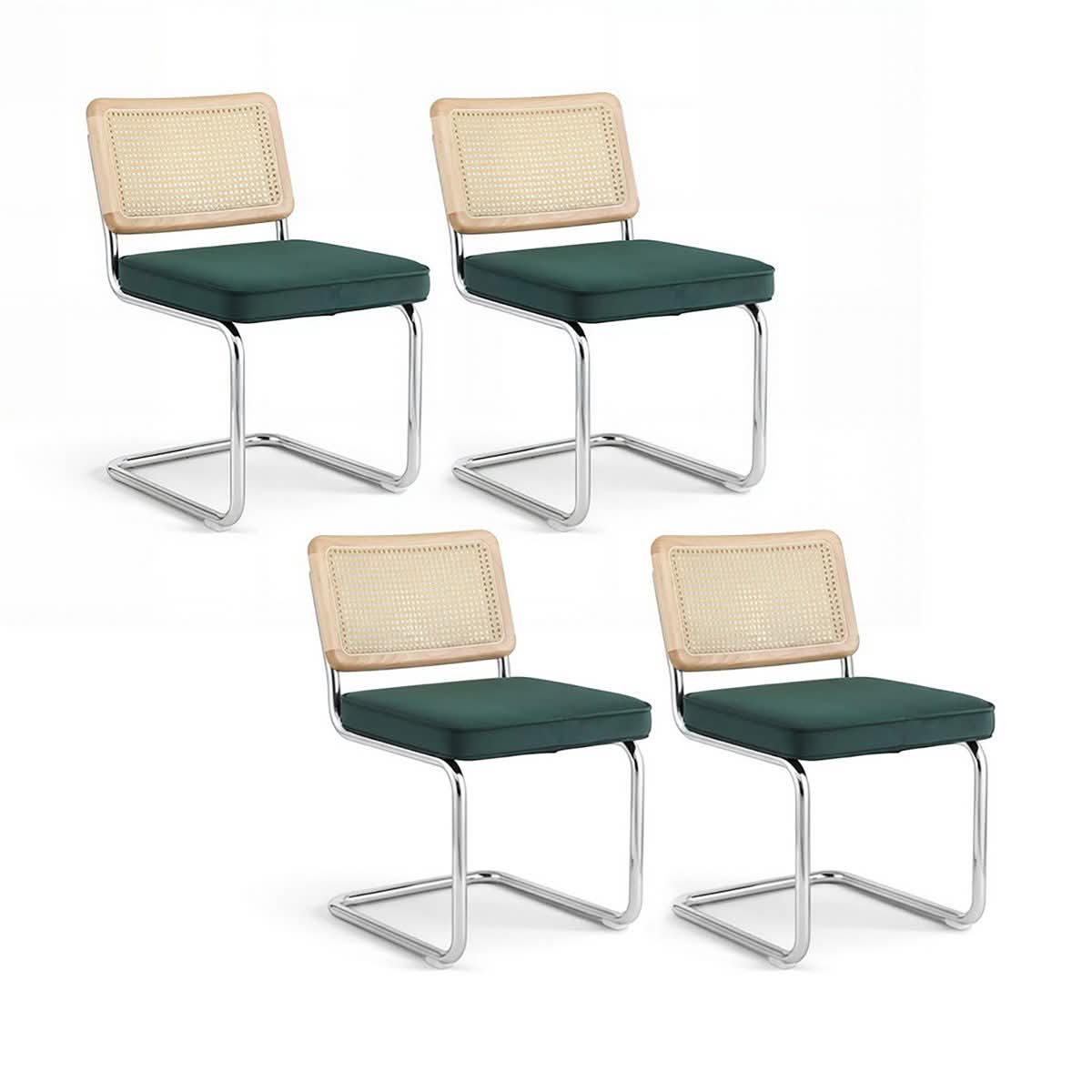 green velvet chair on a bent cantilever frame