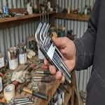 A person holding a selection of the best allen key sets Australia has to offer, showing different sizes.