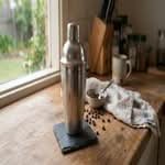 A close-up, candid smartphone photo of the best cocktail shaker sets in Australia on a kitchen counter.