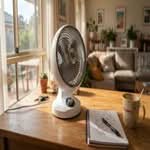 Close-up candid shot of the best desk fans in Australia on a home office desk.