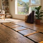 The best agility ladder in Australia laid out on a living room floor ready for a workout.