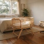A modern baby bassinet set up in a sunlit bedroom, representing the best bassinet australia options for parents.