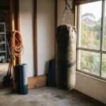A heavy boxing bag hanging in a bright Australian home gym setting representing the best boxing bag australia options.