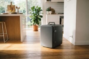 A modern portable fridge in a bright Australian home setting, highlighting the best portable fridge australia options.