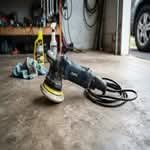 A top car polisher for sale in Australia, shown in a realistic garage setting.