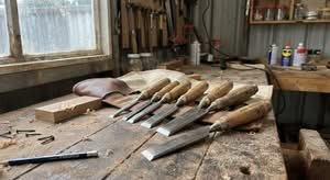 Close-up of the best chisel set Australia has to offer, laid out on a workbench.