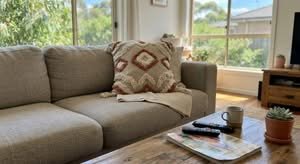 Close-up of one of the best cushion covers Australia has to offer, displayed on a sofa.